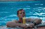 craig drinking a pineapple shake with vietnam rum at cory and selena's hotel swimming pool